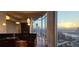Modern kitchen featuring black granite countertops, stainless steel appliances, with expansive skyline views at 3324 Peachtree Ne Rd # 3001, Atlanta, GA 30326