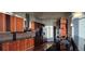 Modern kitchen featuring stainless steel appliances, dark wood cabinetry and granite countertops at 3324 Peachtree Ne Rd # 3001, Atlanta, GA 30326