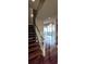 Bright living room with floor-to-ceiling windows and hardwood floors located off the staircase at 3324 Peachtree Ne Rd # 3001, Atlanta, GA 30326