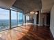 Open living room featuring hardwood floors and beautiful lighting at 3324 Peachtree Ne Rd # 3001, Atlanta, GA 30326