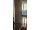 View of a staircase with modern steel railings and hardwood floors leading upstairs, flooded with natural light at 3324 Peachtree Ne Rd # 3001, Atlanta, GA 30326
