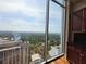 Stunning view from condo featuring expansive windows, and the tree tops of the neighborhood at 3324 Peachtree Ne Rd # 3001, Atlanta, GA 30326