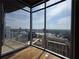 Corner view featuring expansive windows, hardwood floors, and a stunning city view at 3324 Peachtree Ne Rd # 3001, Atlanta, GA 30326