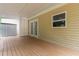 Well-maintained back porch with access to the home's interior at 3781 Cherokee Trl, Suwanee, GA 30024