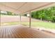 Covered back porch overlooks a landscaped backyard at 3781 Cherokee Trl, Suwanee, GA 30024