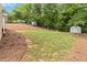 Extensive grassy backyard with mature shade trees at 3781 Cherokee Trl, Suwanee, GA 30024