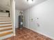 Clean basement area features tile flooring and stairs at 3781 Cherokee Trl, Suwanee, GA 30024