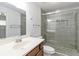 Updated bathroom with glass shower and modern vanity at 3781 Cherokee Trl, Suwanee, GA 30024
