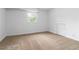 Comfortable bedroom featuring neutral carpet and plenty of light at 3781 Cherokee Trl, Suwanee, GA 30024