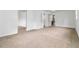 Spacious bedroom featuring neutral carpeting and multiple doorways offering versatility and convenience at 3781 Cherokee Trl, Suwanee, GA 30024