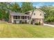Charming two-story home with a brick chimney, red shutters, and manicured landscaping at 3781 Cherokee Trl, Suwanee, GA 30024