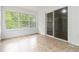 Bright sunroom with tan tile and multiple windows and sliding glass door at 3781 Cherokee Trl, Suwanee, GA 30024