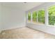 Bright sunroom with tan tile and multiple windows bringing the outdoors in at 3781 Cherokee Trl, Suwanee, GA 30024