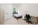 This bedroom includes a large closet, dedicated workspace, and serene wooded view at 1589 Bennett Creek Overlook, Suwanee, GA 30024