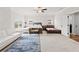 Large bedroom featuring carpet, neutral paint, and multiple windows offering ample natural light at 1589 Bennett Creek Overlook, Suwanee, GA 30024