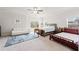 Spacious bedroom with neutral carpet, two beds, ceiling fan, and plenty of natural light at 1589 Bennett Creek Overlook, Suwanee, GA 30024
