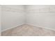 Empty walk-in closet with shelving ready for storage, providing an opportunity for organization and personalization at 1589 Bennett Creek Overlook, Suwanee, GA 30024