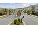 Gated community entrance with brick pillars, iron gates, and manicured landscaping at 1589 Bennett Creek Overlook, Suwanee, GA 30024