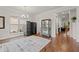 Bright dining area with hardwood floors, large windows, and modern decor at 1589 Bennett Creek Overlook, Suwanee, GA 30024
