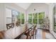 An additional dining space offers large windows overlooking the beautiful wooded landscape at 1589 Bennett Creek Overlook, Suwanee, GA 30024