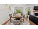 Elegant dining room featuring a large table, chairs, and hardwood floors at 1589 Bennett Creek Overlook, Suwanee, GA 30024