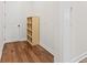 The hall features hardwood floors and a small shelving unit at 1589 Bennett Creek Overlook, Suwanee, GA 30024