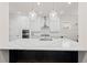 Modern kitchen with a large island, stainless steel appliances, and pendant lighting at 1589 Bennett Creek Overlook, Suwanee, GA 30024