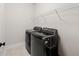 Convenient laundry room with modern washer and dryer, offering efficiency for everyday tasks at 1589 Bennett Creek Overlook, Suwanee, GA 30024