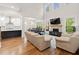 Open concept living space with fireplace adjoins the kitchen and additional dining area at 1589 Bennett Creek Overlook, Suwanee, GA 30024