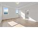 Open and airy bedroom with trey ceiling, two windows and luxury vinyl plank floors at 1682 Juniper Berry Way, Loganville, GA 30052