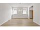 Elegant dining room with ample natural light and a modern chandelier at 1682 Juniper Berry Way, Loganville, GA 30052
