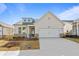 Charming single-Gathering home boasting a two-car garage and attractive curb appeal at 1682 Juniper Berry Way, Loganville, GA 30052