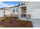 Inviting front entrance with beautiful landscaping and a welcoming front door at 1682 Juniper Berry Way, Loganville, GA 30052