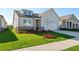 Lovely home showcasing a lush green lawn and neutral tones providing great curb appeal at 1682 Juniper Berry Way, Loganville, GA 30052