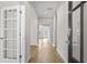 Inviting hallway showcasing hardwood floors and access to multiple rooms throughout the home at 1682 Juniper Berry Way, Loganville, GA 30052