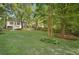 Expansive backyard featuring a lush lawn and mature trees, perfect for outdoor activities at 2672 Birchwood Dr, Atlanta, GA 30305
