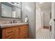 Bathroom vanity with marble countertop, dark faucet, and neutral gray walls at 2672 Birchwood Dr, Atlanta, GA 30305