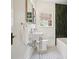 Bathroom featuring a vintage style pedestal sink and black and white patterned tile floor at 2672 Birchwood Dr, Atlanta, GA 30305
