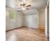 Bright, airy bedroom featuring a ceiling fan, window, and hardwood floors at 2672 Birchwood Dr, Atlanta, GA 30305