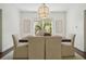 A well-lit dining room with a modern chandelier and neutral tones creates an inviting space at 2672 Birchwood Dr, Atlanta, GA 30305