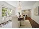 Bright dining room with hardwood floors, chandelier, and view of the kitchen at 2672 Birchwood Dr, Atlanta, GA 30305