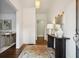 Bright entryway with hardwood floors, stylish rug, mirror, and decorative console table at 2672 Birchwood Dr, Atlanta, GA 30305