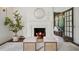 Cozy fireplace with white mantel, round mirror, and stylish decor at 2672 Birchwood Dr, Atlanta, GA 30305