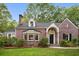 Charming red brick two-story home with manicured lawn and beautiful landscaping at 2672 Birchwood Dr, Atlanta, GA 30305