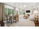 Bright and airy living room featuring hardwood floors, a fireplace, and large windows at 2672 Birchwood Dr, Atlanta, GA 30305