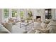 Elegant living room with fireplace, neutral furnishings, and plenty of natural light at 2672 Birchwood Dr, Atlanta, GA 30305