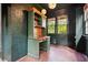 Charming sun room with brick walls, hardwood floors, and built-in desk at 2672 Birchwood Dr, Atlanta, GA 30305
