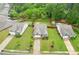 Aerial view of the house with a fenced backyard and landscaping and mature trees at 306 Lark Ln, Canton, GA 30115