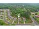 An aerial view showing the location of the property within a quiet, wooded suburban neighborhood at 306 Lark Ln, Canton, GA 30115