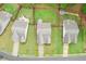 Aerial view showcasing the backyard of a home with a wooden fence and a landscaped patio at 306 Lark Ln, Canton, GA 30115
